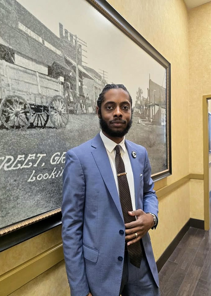 Capacity Expansion Co. leadership professional in a tailored blue suit